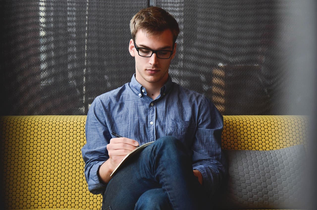 Developer writing code on laptop